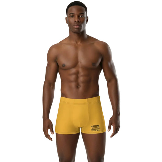 Man wearing yellow boxer briefs on a white background