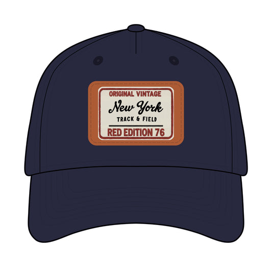 Navy blue cap with a vintage-style label on a white background