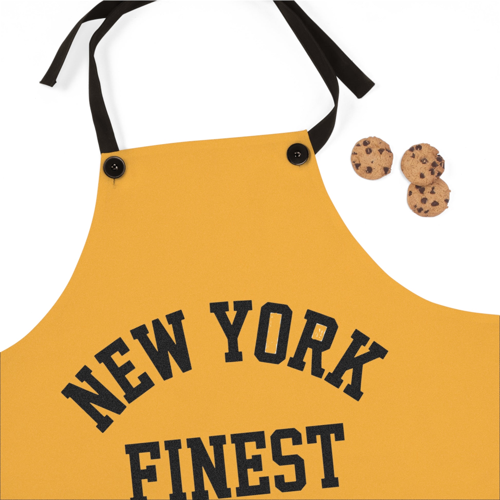 Yellow apron with 'New York Finest' text on a white background