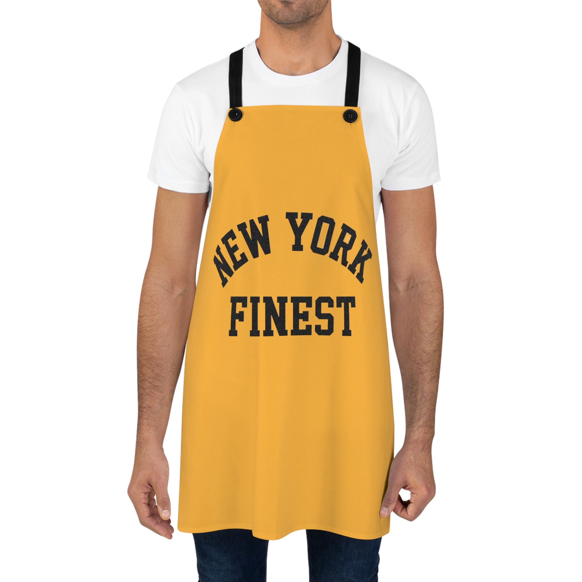Yellow apron with 'New York Finest' text worn by a person on a white background