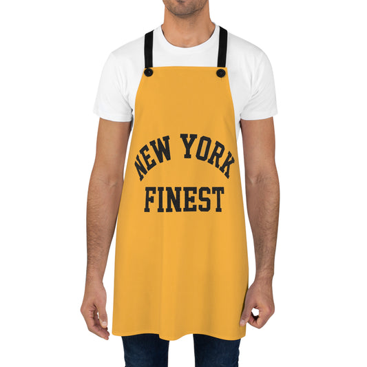Yellow apron with 'New York Finest' text worn by a person on a white background