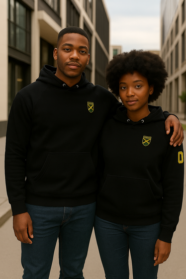 Two people wearing black hoodies with a yellow logo standing in an urban setting.