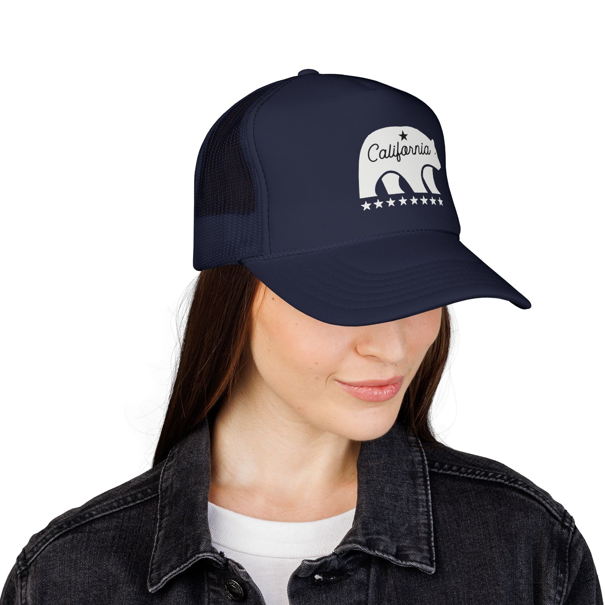 Person wearing a navy blue cap with a white bear and 'California' text on a white background