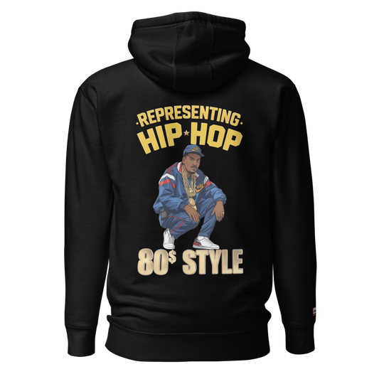 Black hoodie with a graphic of a person in 80s attire and text 'Representing Hip Hop 80s Style' on the back.