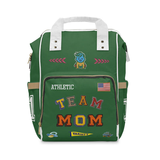 Green backpack with 'Team Mom' text and various patches on a white background