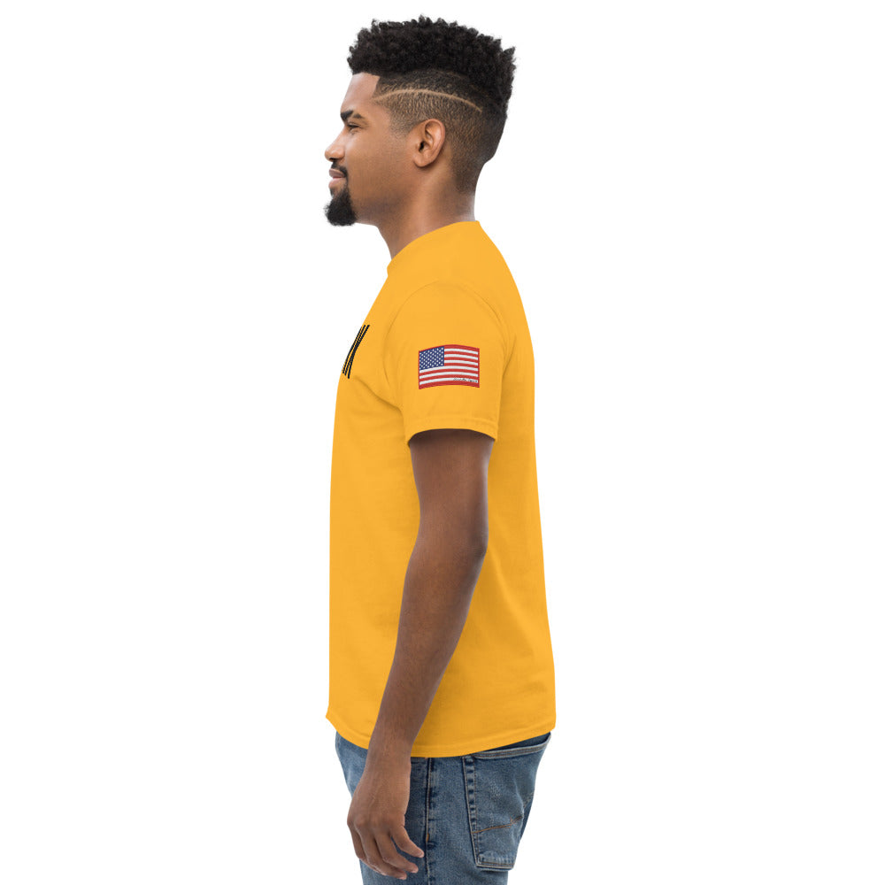 Man wearing a yellow t-shirt with an American flag on a white background