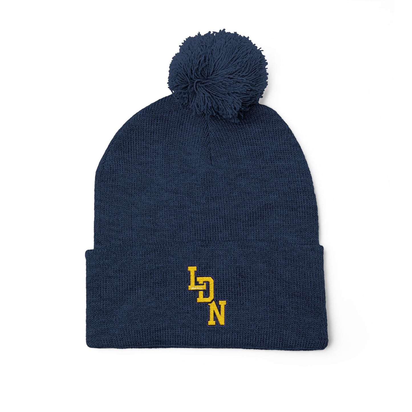 Navy blue beanie with pom-pom and yellow logo on a white background