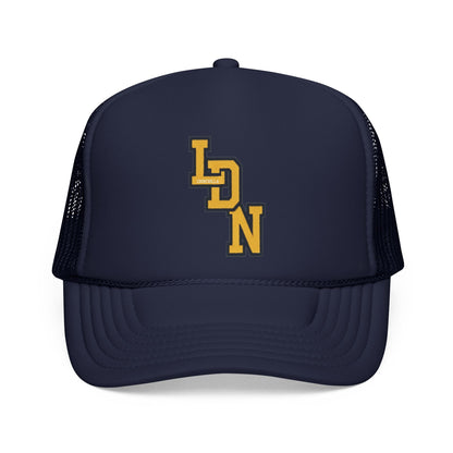 Navy blue trucker cap with yellow logo on a white background