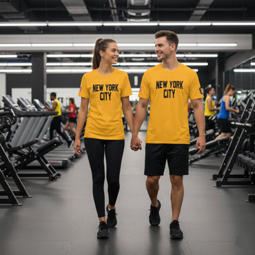 Two people walking in a gym wearing 'New York City' t-shirts.