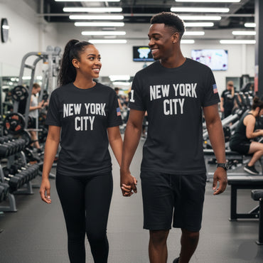 Two people wearing 'New York City' t-shirts walking in a gym.