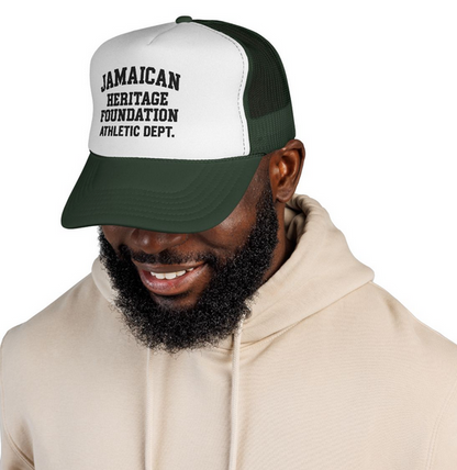 Man wearing a cap with 'Jamaican Heritage Foundation Athletic Dept.' text on a white background