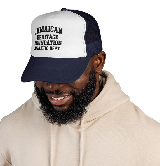 Person wearing a cap with 'Jamaican Heritage Foundation Athletic Dept.' text on a white background
