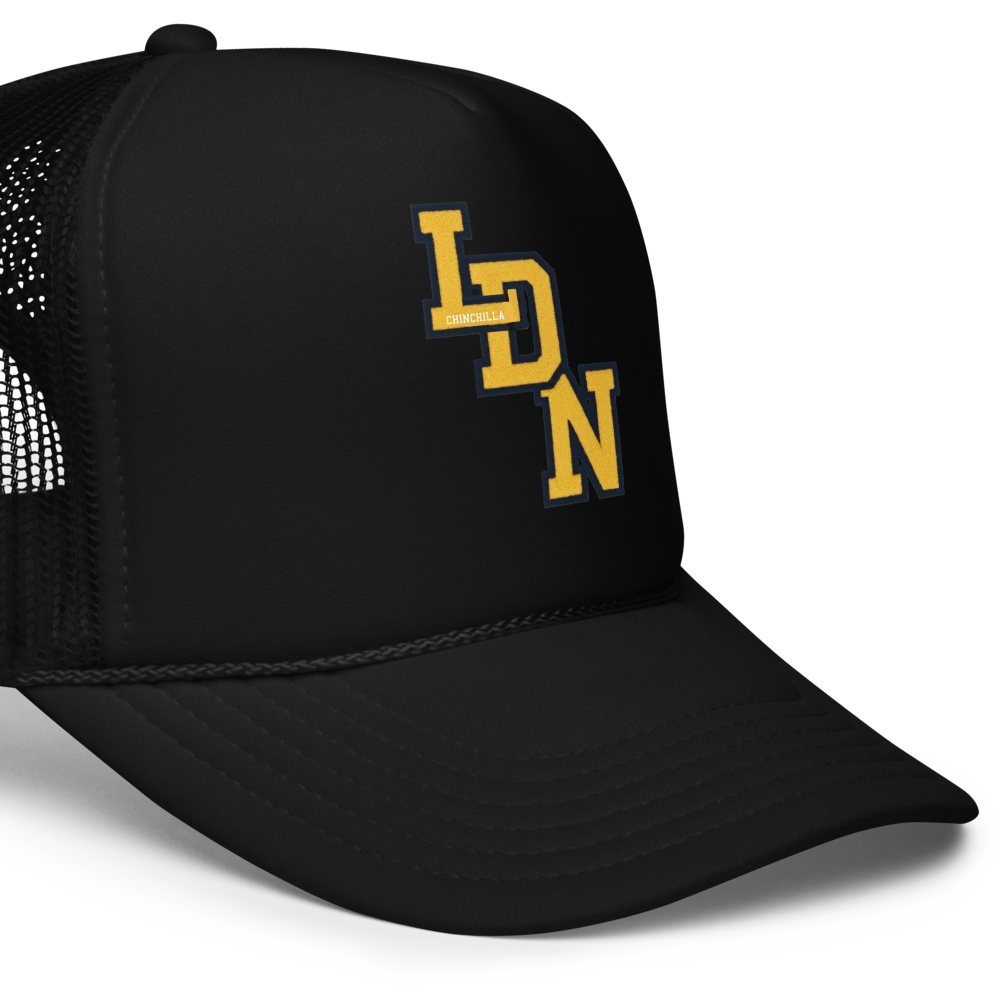 Black trucker cap with yellow logo on a white background