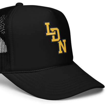 Black trucker cap with yellow logo on a white background