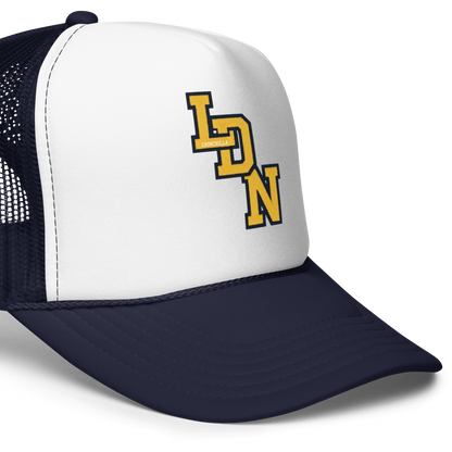 White and navy trucker hat with 'LDN' logo on a white background