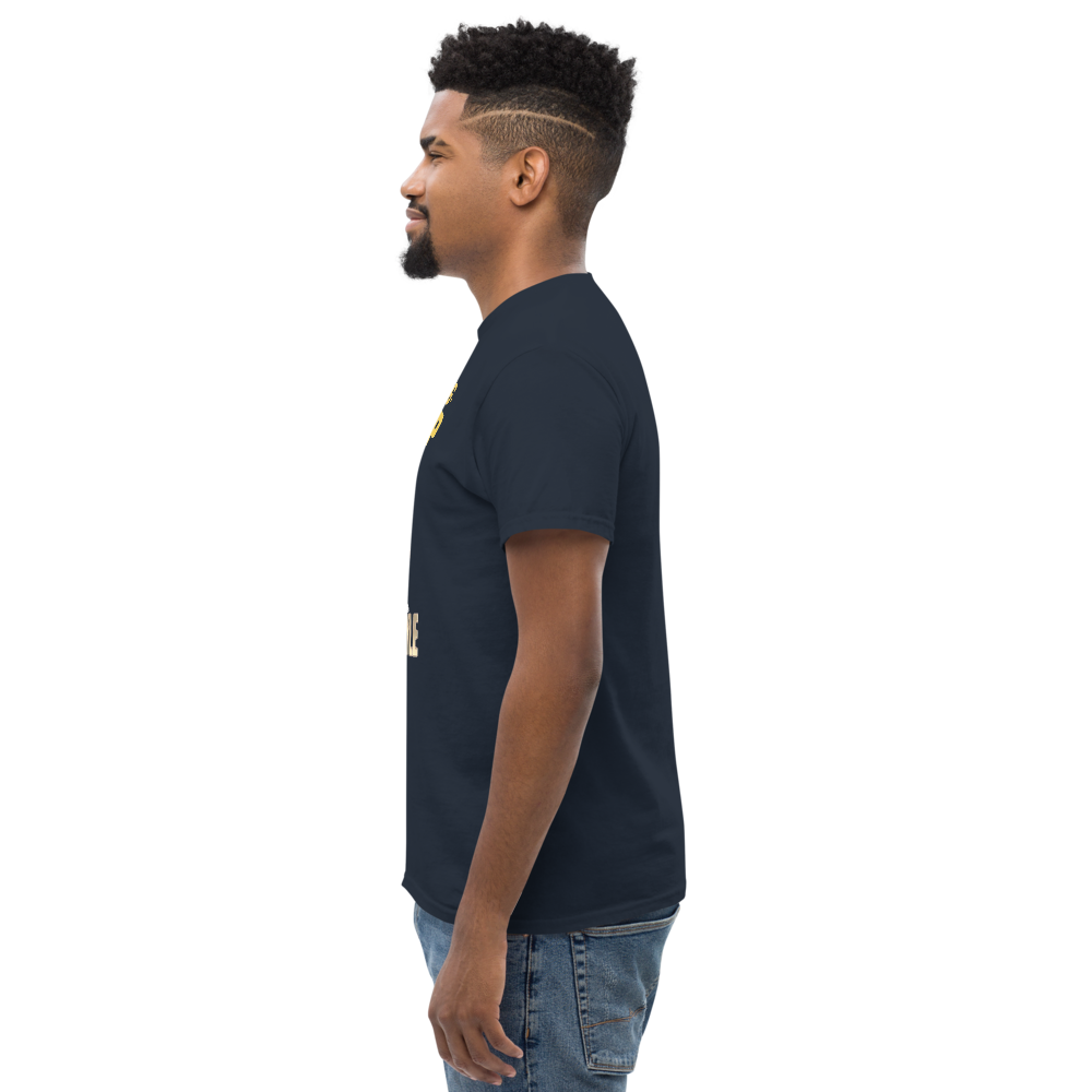 Man wearing a black t-shirt with a logo on a white background