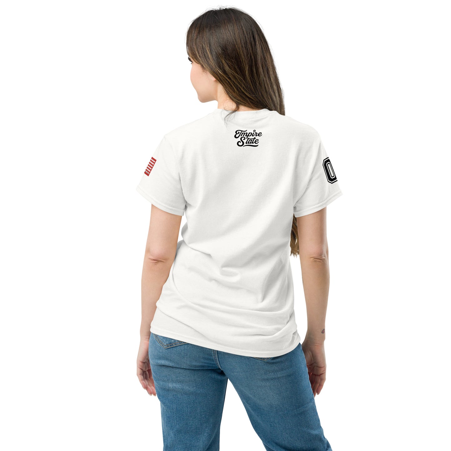 Person wearing a white t-shirt with logos on the back, standing against a white background