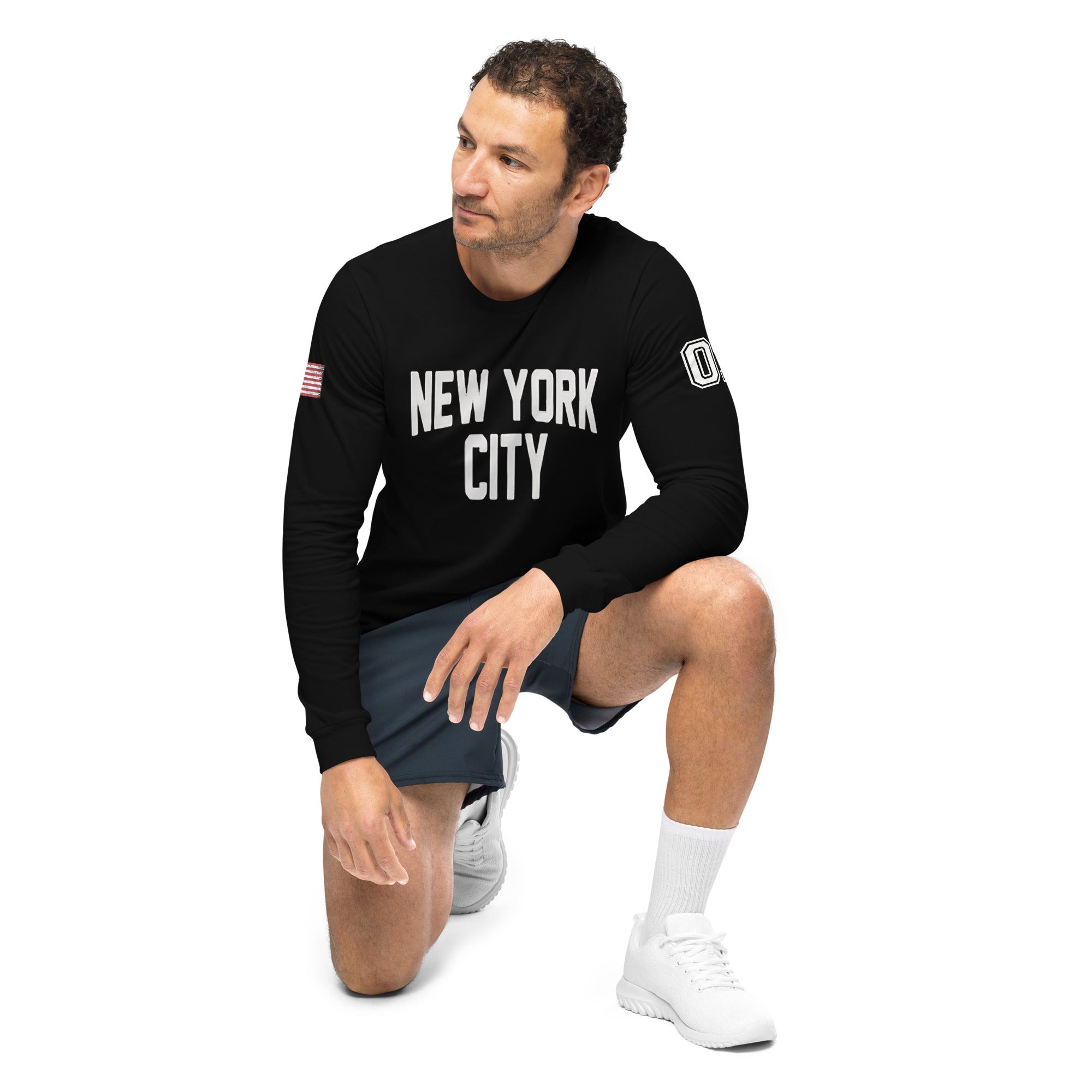Man wearing a black 'New York City' sweatshirt on a white background