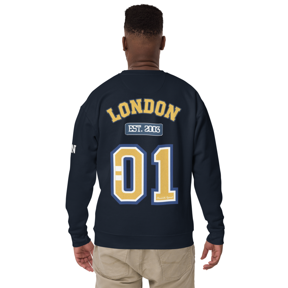 Person wearing a navy blue sweatshirt with 'London' and '01' printed on the back.