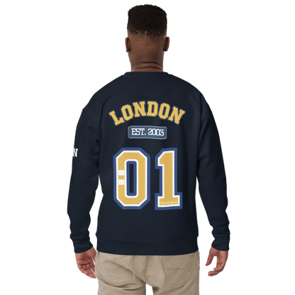 Person wearing a navy blue sweatshirt with 'London' and '01' printed on the back.