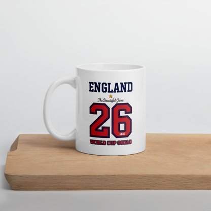 White mug with 'England' and number '26' design on a wooden surface