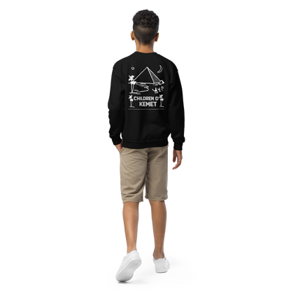 Person wearing a black sweatshirt with a design and text on the back, standing against a white background